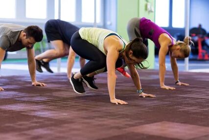 The group performs berpie exercise